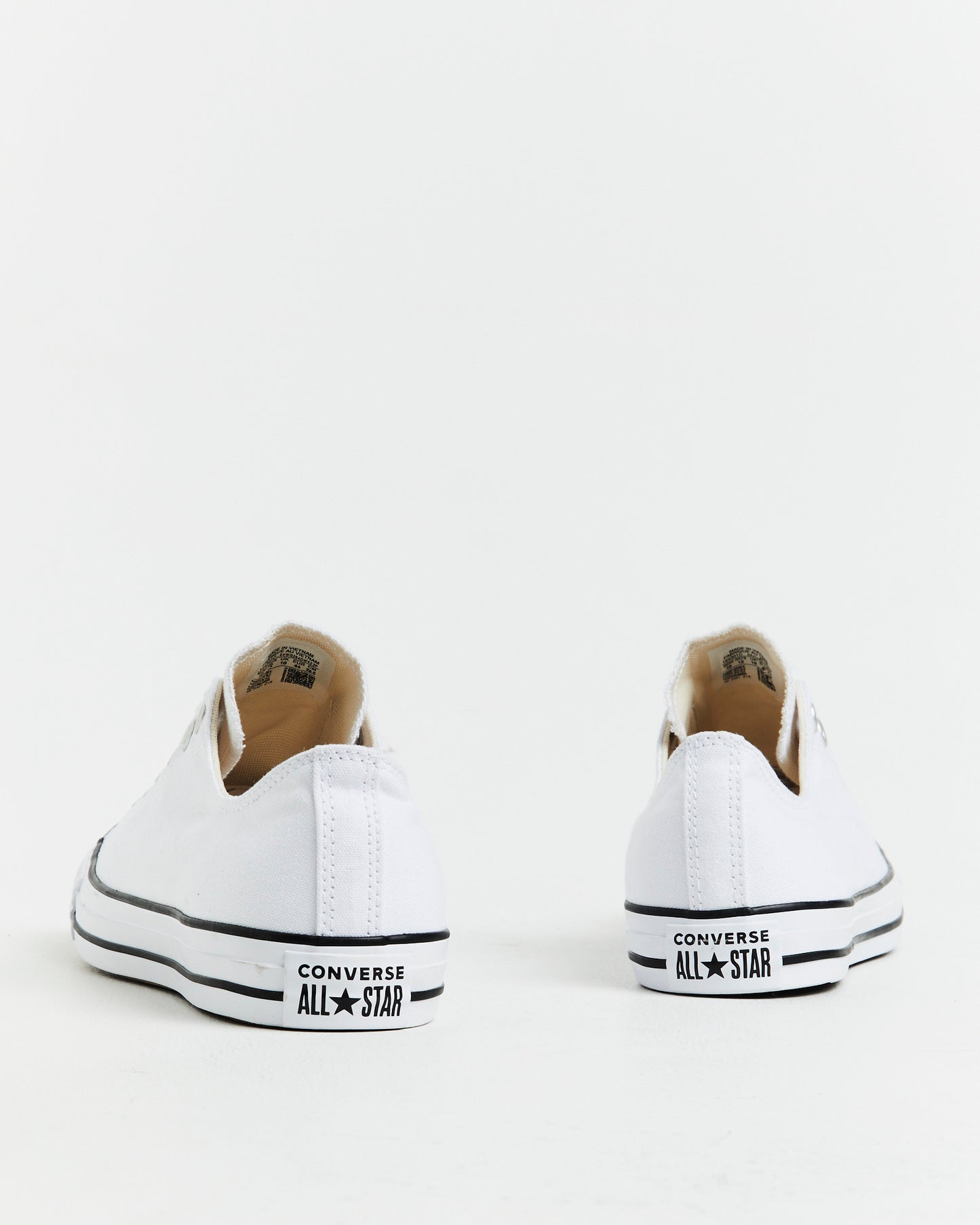 Chuck Taylor All Star Slip On Sneakers In White/Black